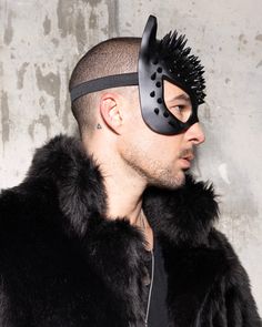 Masquerade Mask - Spiked, Black Cat Step into the wild with our Black Cat Masquerade Mask. This spiked masterpiece is crafted from lightweight materials for all-night comfort, giving you a fierce, head-turning look without compromise. Perfect for Halloween costumes, cosplay conventions, music festivals, or any event you want to show off your inner feline. The sleek black design and bold spikes are made to make a statement -- trust us, if you pair this with one of our coats or hoods, you're bound Fitted Black Costume Accessories For Alternative Fashion, Edgy Halloween Costume Accessories, Black Fitted Punk Costume Accessories, Edgy Black Costume Accessories For Alternative Fashion, Edgy Halloween Costume Accessories For Party, Edgy Black Accessories For Alternative Fashion, Alternative Black Costume Accessories For Costume Party, Fitted Black Punk Costume Accessories, Fitted Black Costume Mask