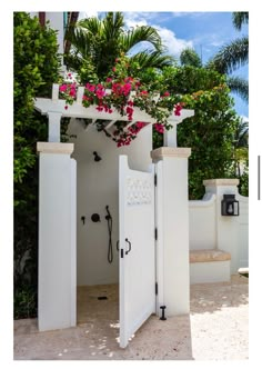 an open white door with pink flowers on it