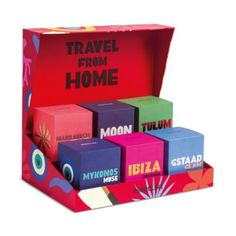 a box with different colored blocks in it and the words travel from home written on them