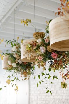 flowers are hanging from the ceiling in a room