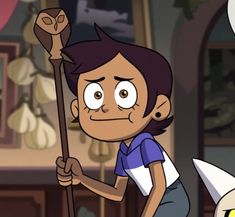 a cartoon character holding a stick in one hand and looking at the camera while another person looks on