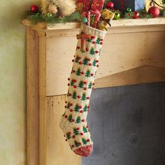 a christmas stocking hanging from a mantel