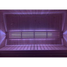 the inside of a sauna with purple lights