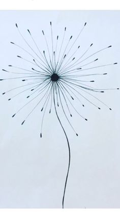 a dandelion in the sky with lots of small black dots