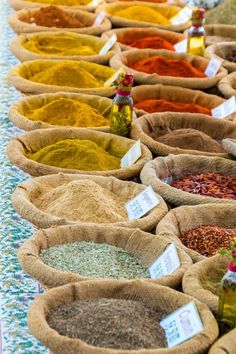 many bags filled with different types of spices