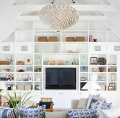 a living room filled with furniture and a flat screen tv