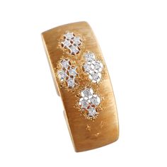 Classic 18 gold cuff bracelet by Mario Buccellati, set with approx. 1.28ctw VS-SI/H diamonds. DESIGNER: Buccellati MATERIAL: 18k Yellow Gold GEMSTONES: Diamond DIMENSIONS: Bracelet will fit approx. 6.5" wrist and is 1" wide. MARKED/TESTED: M. Buccellati, Italy, 750, Italian Buccellati mark. WEIGHT: 53.2 grams CONDITION: Previously Owned / Excellent Condition. Diamond Gold Bracelet, Gold Cuff Bracelet, Gold Bracelet Cuff, Gold Cuffs, Georg Jensen, Diamond Gold, Selling Jewelry, Gemstone Bracelet, Estate Jewelry