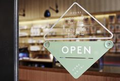 an open sign in front of a store window