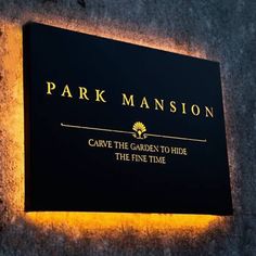 a sign that is on the side of a building saying park mansion carpie the garden to hide the fine time