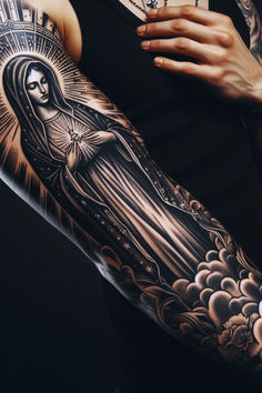 Unique Virgin Mary Tattoo Design
#VirginMaryTattoo #ReligiousArt #DivineInspiration #TattooDesigns #FaithSymbols #SpiritualArt #BlessedMother #DivineFeminine #ChristianTattoo #SacredInk #InkInspiration #CatholicArt #Symbolism #IntricateDesign #InnerStrength #SpiritualJourney #TattooIdeas #FaithfulArt #ReligiousSymbolism Mens Virgin Mary Tattoo, Feminine Rosary Tattoo, Blessed Virgin Mary Tattoo, Virgin Mary Portrait Tattoo, Virgin Mary Shoulder Tattoo, Virgin Mary Tattoo Shoulder, Tattoo Of God, Mother Mary Tattoo Design, St Mary Tattoo