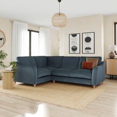 a living room with a large blue couch