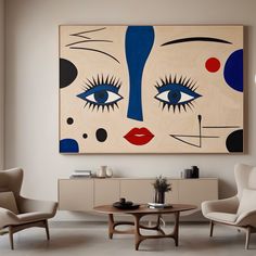 a living room with two chairs and a painting on the wall above it's coffee table