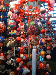 an assortment of ornaments hanging from the ceiling