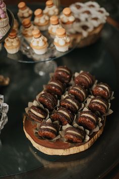 desserts and pastries are arranged on a table