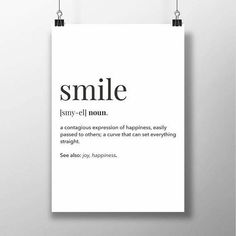 a white poster with the words smile on it