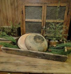 an old wooden box with some plants in it