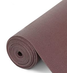 a yoga mat rolled up on top of each other