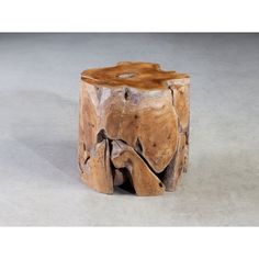 a piece of wood that has been carved into a tree stump and is sitting on a white background