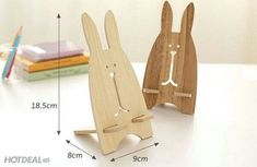 the wooden toy is shaped like a rabbit