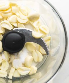 peeled bananas in a food processor with a black lid