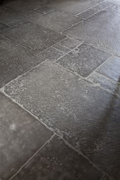 a black and white photo of a tile floor