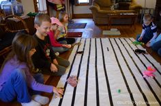 a group of children sitting on the floor playing with toys