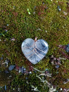 "Handmade copper wire wrapped Black Rutilated Quartz crystal heart pendant necklace. This black rutilated quartz crystal heart is wrapped in a minimalist style with bare copper wire. I love this style for it's simplicity and humanistic design as it depicts a heart inside a rib cage. This is the perfect gift to show love and appreciation to a loved one or yourself! You can choose between four different chain or cord options - 1 mm cotton cord, 2 mm cotton cord, 1 mm \"dainty\" chain, 1.7 mm \"bold\" chain. Both chain options are made from tarnish resistant copper. Both cotton cord options come with a very generous length to be knotted or finished as you like! Please be mindful that bare copper wire will start to show patina and tarnish over time. The aging of copper wire can be either beaut Heart Shaped Crystal Wire Wrap, Wire Wrap Rocks, Heart Wire Wrap, Wire Wrapped Heart Stone, Wire Wrapped Rocks, Wire Wrapped Stones, Wire Wrapped Crystals, Wire Wrapped Crystal Necklace, Wire Wrapped Heart