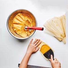 a person using a measuring scale to measure food