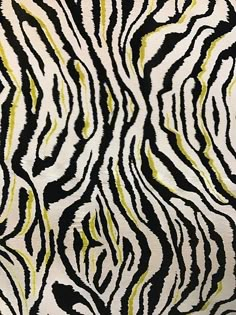 an animal print fabric with black and yellow stripes