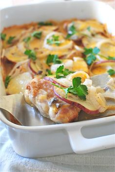 a casserole dish with meat and vegetables in it