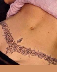 a woman with a tattoo on her stomach