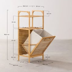 a tall wooden shelf with two bins on it's sides and measurements for each section