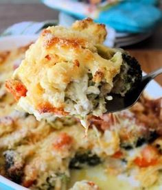 a spoon full of broccoli and cheese casserole