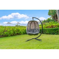 an outdoor swing chair in the grass