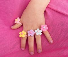 Pastel Flower Ring perfect for toddler and little girls. These little rings are a fun, affordable gift for kids, and add a pop of fun to any spring outfit.  This is for toddler and little kids, and too small for adults. It is not recommended for children under 3 years old, as it can pose as a choking hazard. The ring measures 14mm in diameter, or a size 3. Ideal for children age 3-6. MATERIALS USED -Approximately 18mm resin flower in pink, yellow, blue, purple, or light pink. -Pink plastic ring base Kid Ring, Hot Pink Jewelry, Silver Baby Bracelet, Toddler Jewelry, Newborn Baby Girl Gifts, Birthday Presents For Her, Kids Easter Basket, Kids Rings