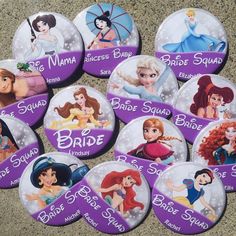 there are many disney princess buttons on the floor