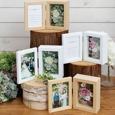 there are many frames on the table with flowers