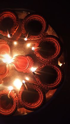 candles are lit in the shape of circles