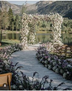 an outdoor ceremony setup with chairs and flowers