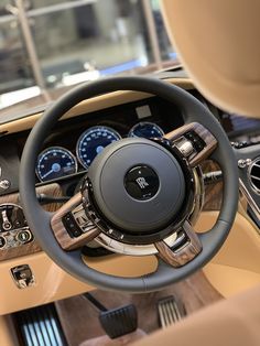 the interior of a car with gauges and steering wheel