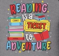 a man wearing a gray shirt with reading is a ticket to adventure on it