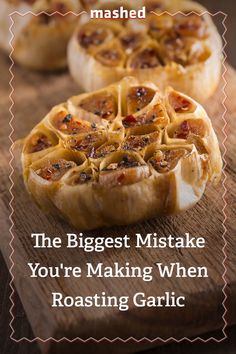 some food is sitting on a cutting board with the words, the biggest mistake you're making when roasting garlic