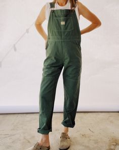 Our bestselling Kneepatch Overalls made with 100% Cotton garment dyed Herringbone Twill. These are based off of our favorite vintage pair of overalls with a slightly shrunken boyish fit. They are a slimmer fit compared to our miner overalls. Adjustable straps, front bib pocket, branded copper hardware. Model in the photo has a 26" waist / 36" hips and is wearing a size 0. Long Sleeve With Overalls, Summer Gardening Outfit, Women’s Overalls, Barista Outfit Casual, Cute Gardening Outfits, Hiking Overalls, Homestead Outfits, Work Overalls Women, Carhartt Overalls Outfit