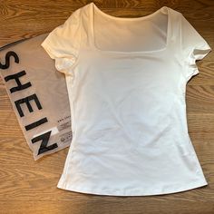 Shien Size Medium Length 22 Inches And Width At 15 Inches Across. Shein White Shirt, White Cute Shirt, Shein Shirts & Tops, White Shirt Y2k, White Shirt Aesthetic, White Fitted Shirt, Cute White Shirt, Shein Shirts, Cute White Shirts