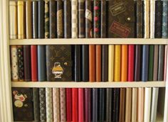 a book shelf filled with lots of different colored books