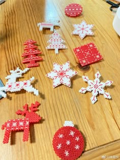 some red and white christmas decorations on a wooden table