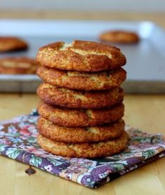 a stack of cookies sitting on top of a wooden table