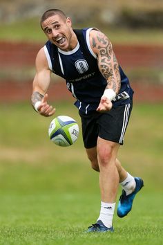 a man running with a soccer ball in his hand