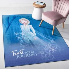 a frozen princess rug with the words trust your journey on it and a chair next to it