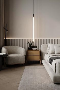 a bed sitting next to a white chair in a bedroom on top of a rug